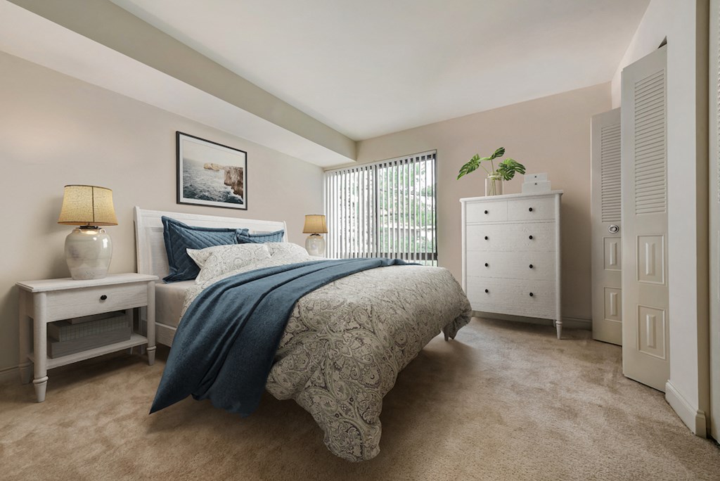 a bedroom with a bed and a dresser and a window