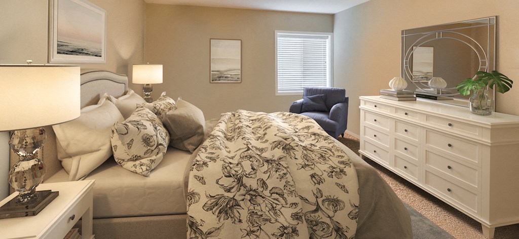 a bedroom with a bed and a dresser with a mirror