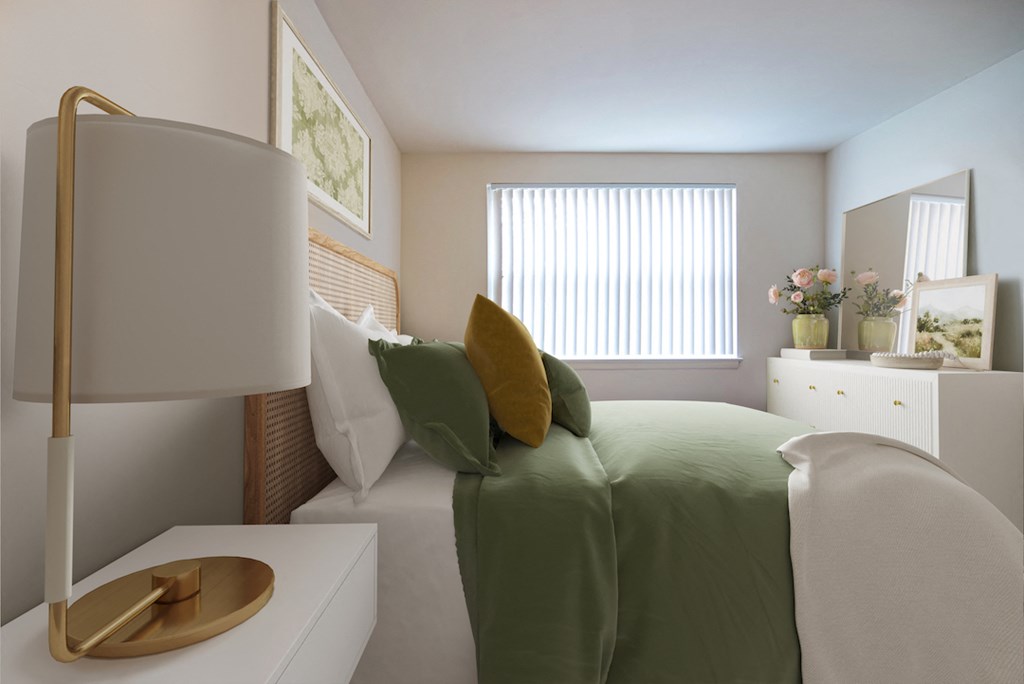 a bedroom with a green bed and a lamp