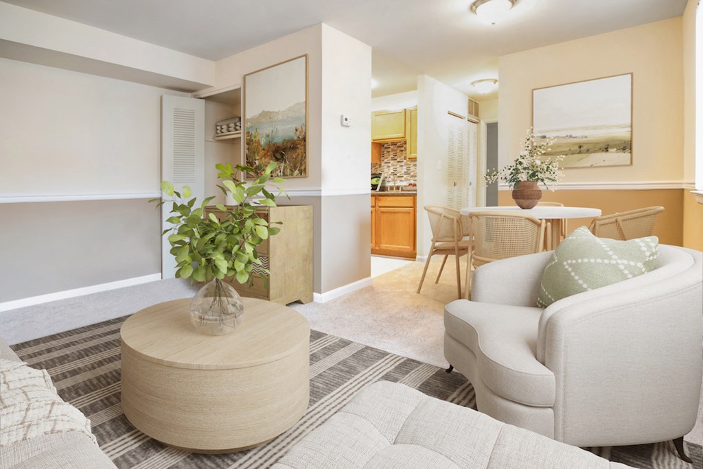 a living room with a couch and a chair and a table