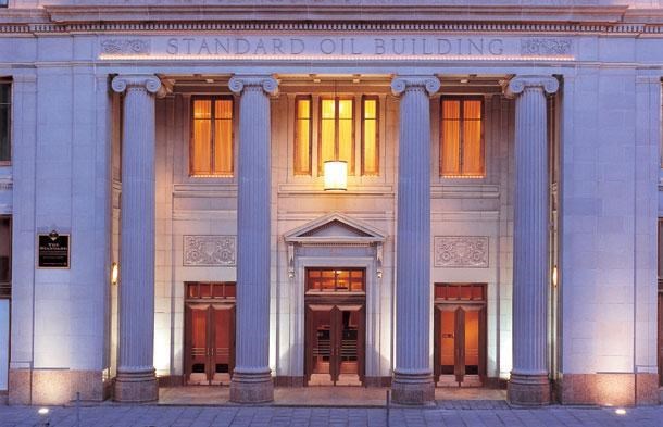 the front of a building with columns and doors