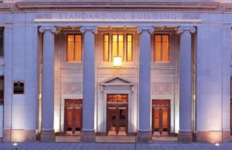 the front of a building with columns and doors