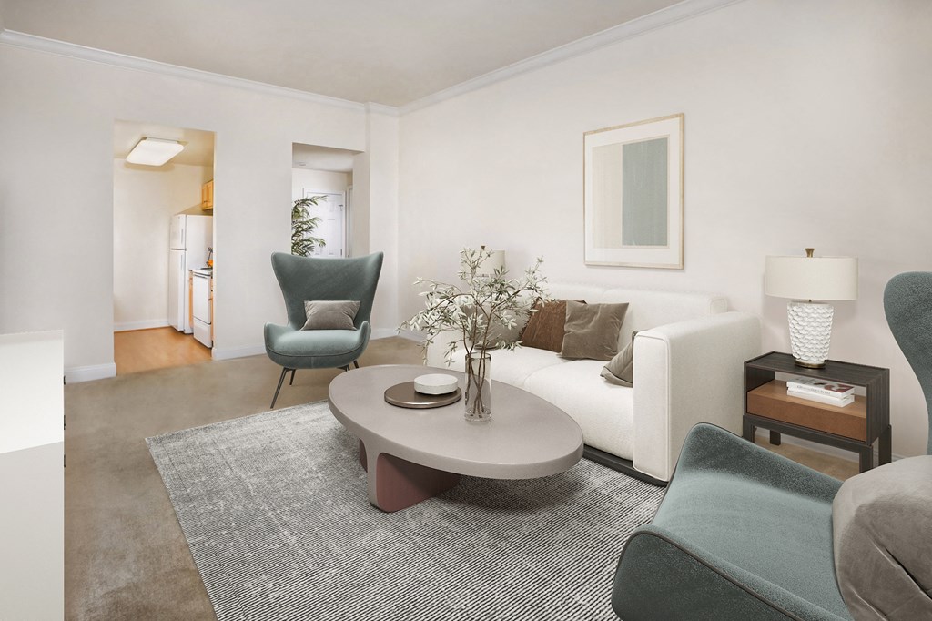 a living room with a white couch and a coffee table