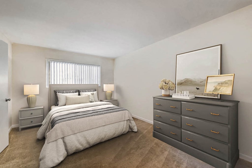 a bedroom with a bed and a dresser