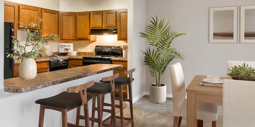 a kitchen and dining room with a table and chairs