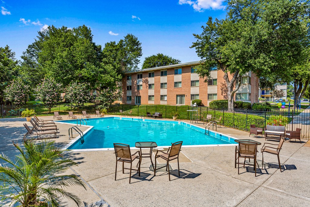 our apartments offer a swimming pool with chairs and tables