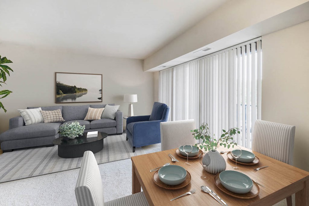 a living room and dining room with a table and chairs