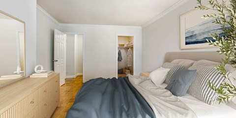 a bedroom with a bed and a closet