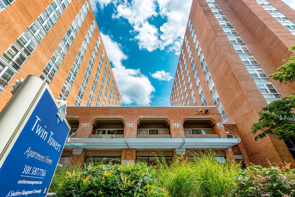 a city building with a blue sign in front