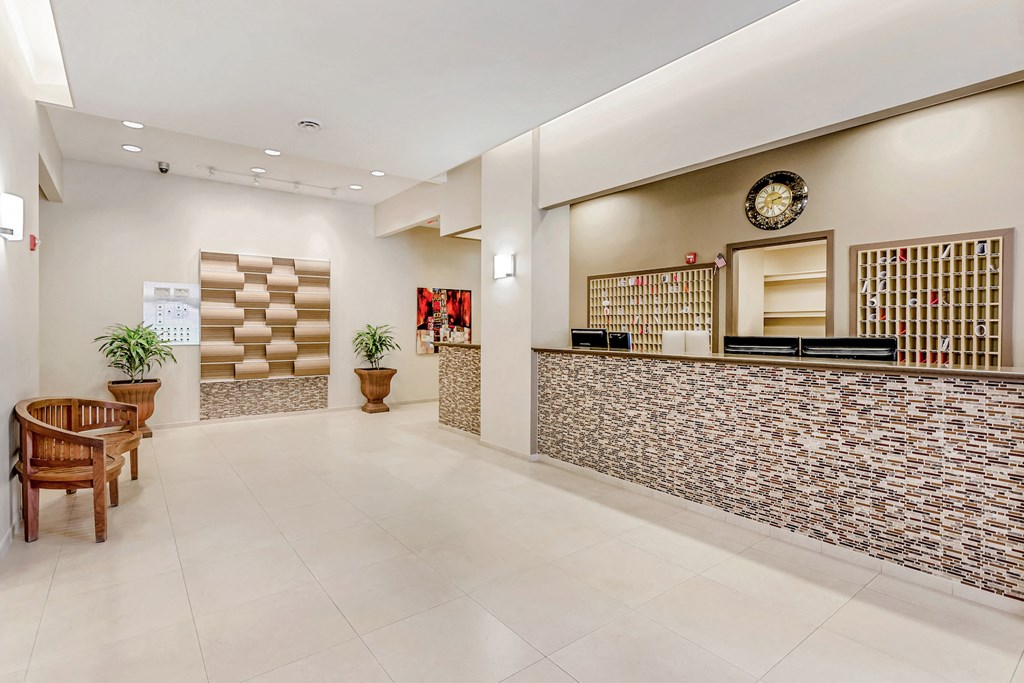 the lobby of a hotel with a reception desk