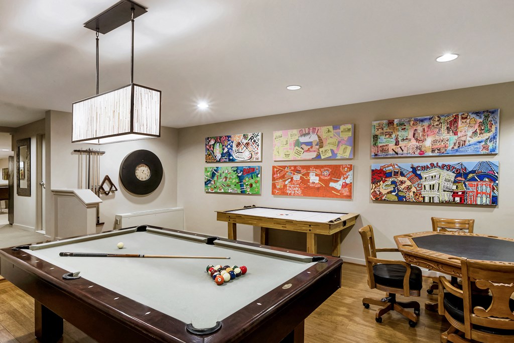 a game room with a pool table and ping pong