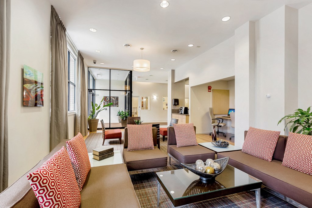 a living room with couches and a coffee table