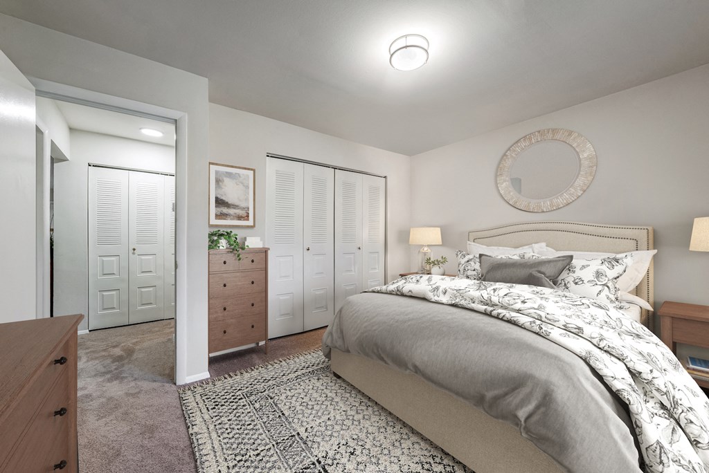 a bedroom with a bed and a closet