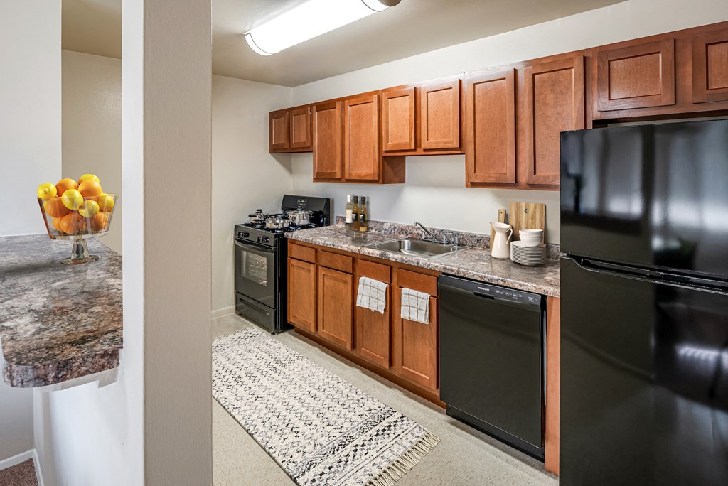 our apartments have a modern kitchen with stainless steel appliances and wood cabinets