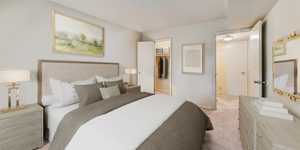 a bedroom with a large bed and a closet