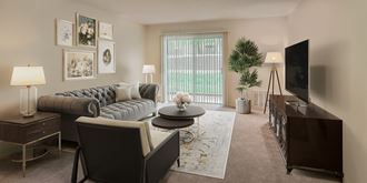 a living room with a couch and a table and a television