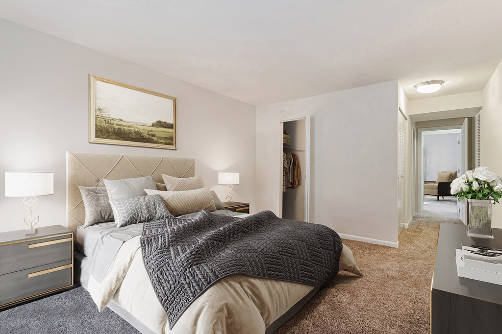 a bedroom with a large bed and a closet