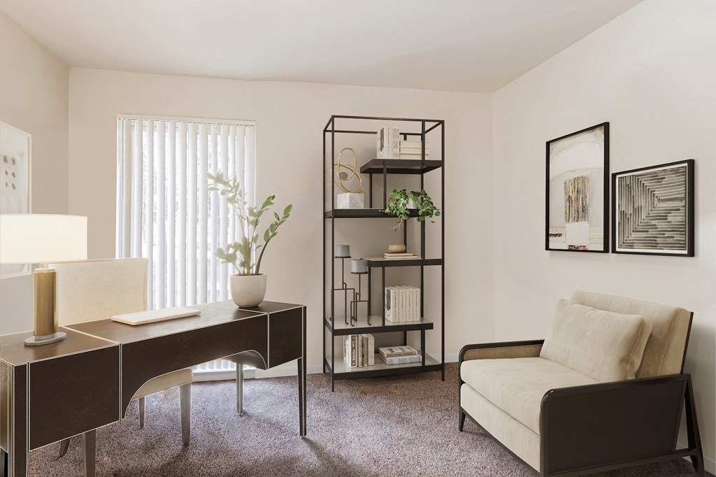 a living room with a desk and a chair