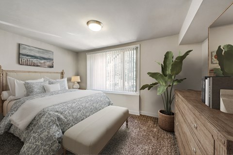 a bedroom with a bed and a dresser and a window