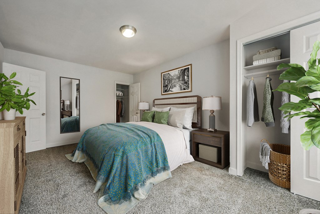 a bedroom with a bed and a closet