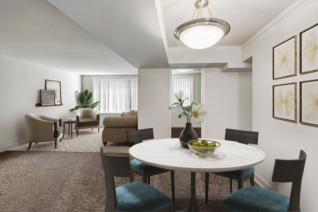 a living room and dining room with a table and chairs