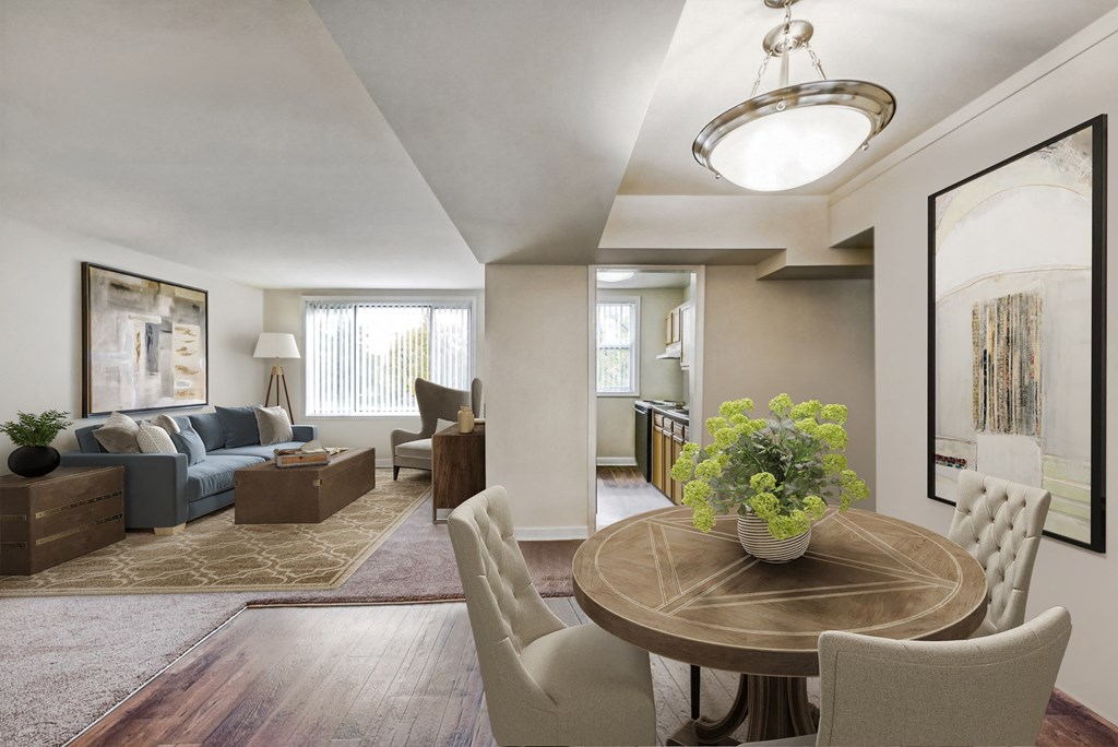 a living room and dining room with a table and chairs