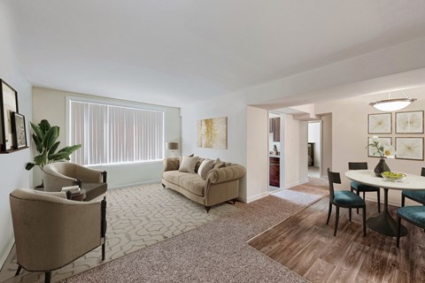 a living room and dining room with couches and a table