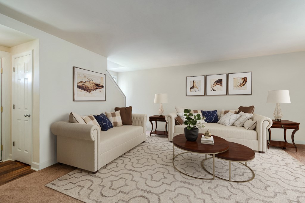 a living room with two couches and a coffee table