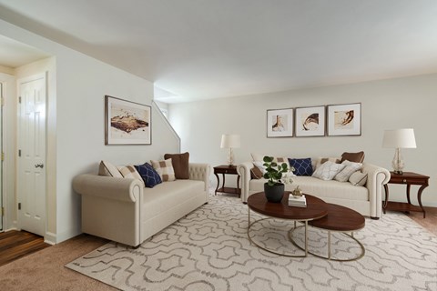 a living room with two couches and a coffee table