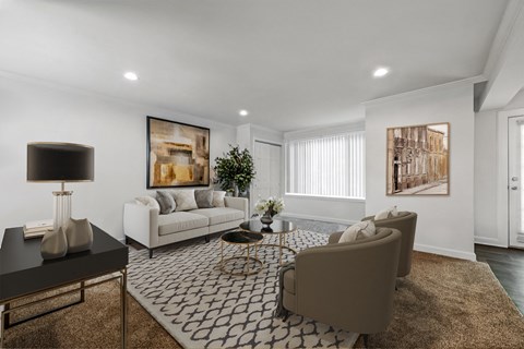 a living room with couches and chairs and a rug