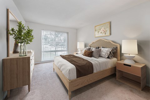 a bedroom with a large bed and a window