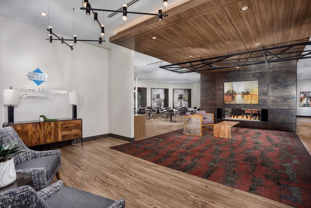 a living room with a fireplace and a rug