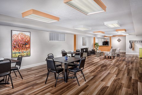 a dining room with a table and chairs