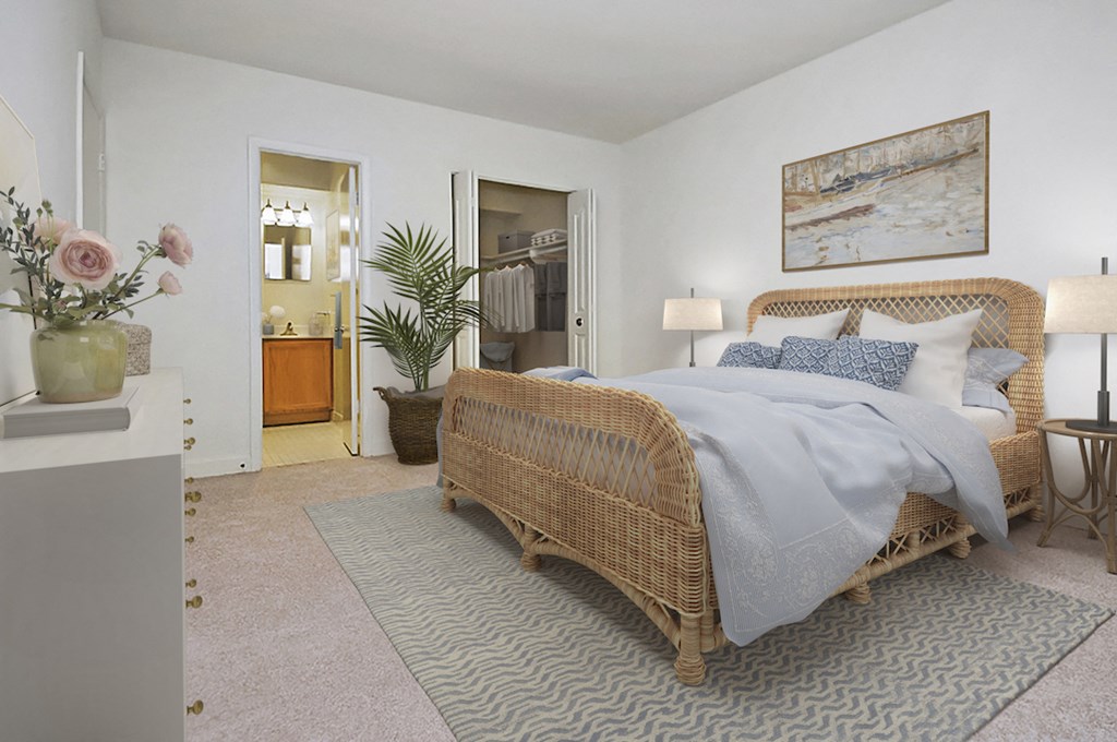 a bedroom with a bed and a plant