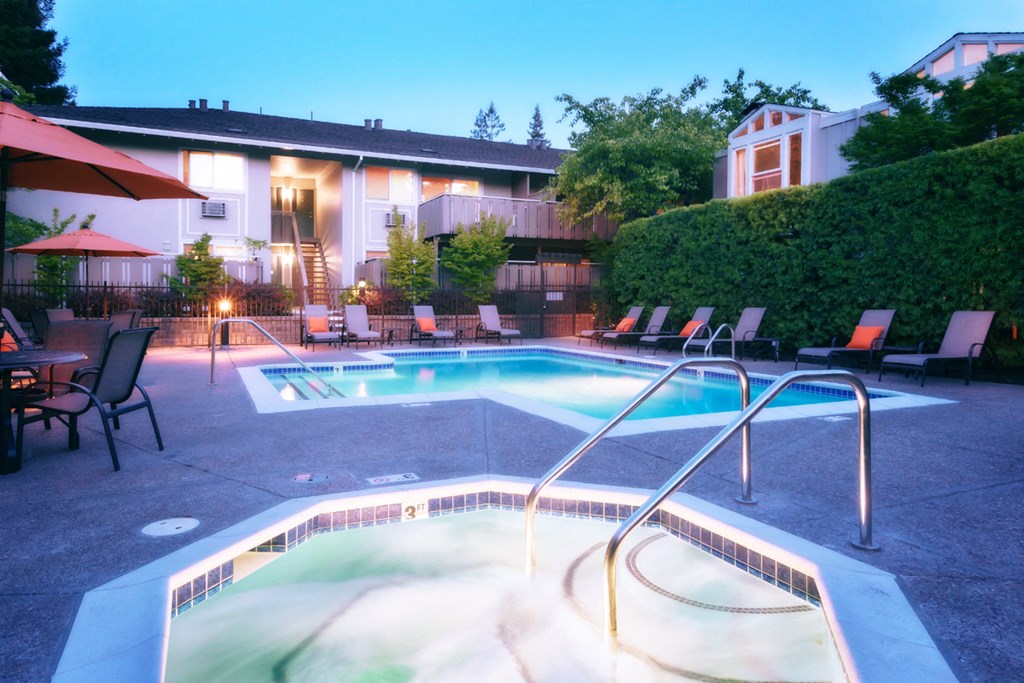 the swimming pool at night at the resort on the falls