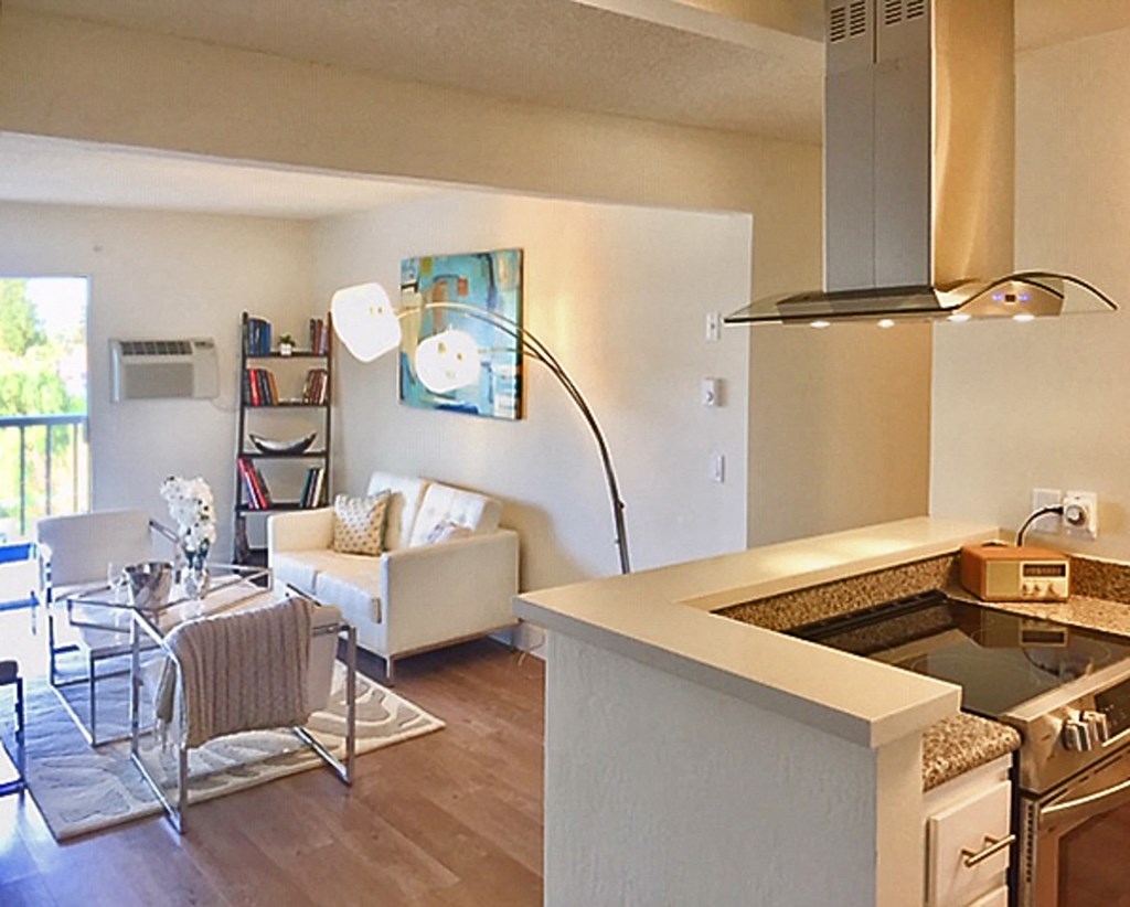 an open floor plan with a kitchen and living room