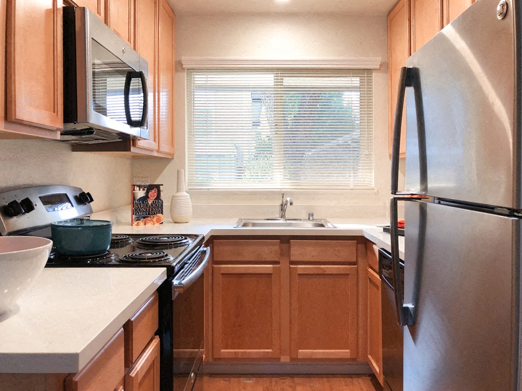 a kitchen with a sink and a refrigerator