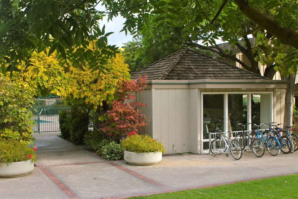 a small building with bikes parked outside of it