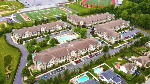 an aerial view of a city with buildings and a parking lot