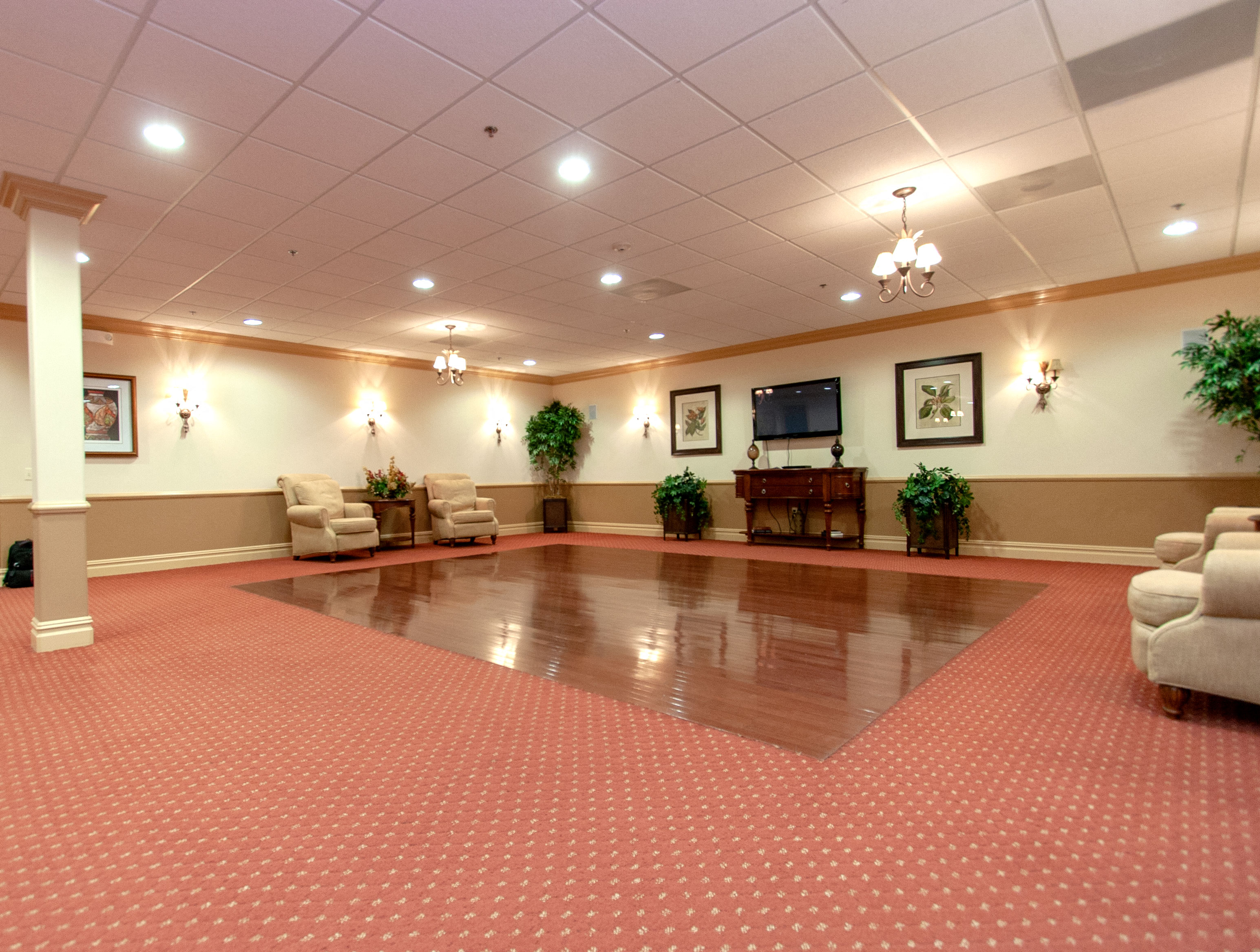 a large room with a dance floor in the center of it