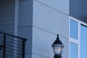 a row of apartments with balconies and a street light