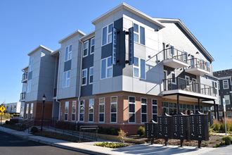 a new apartment building on the corner of a street