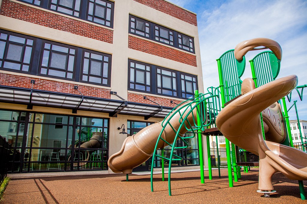a large slide outside of a building