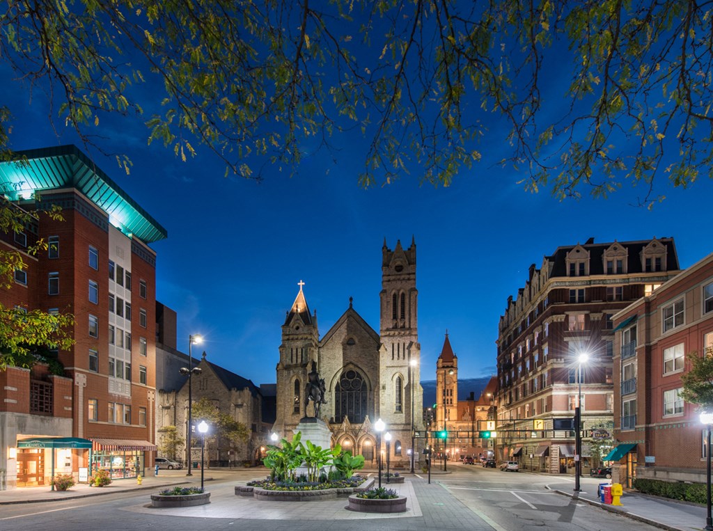 a city street with a church at night