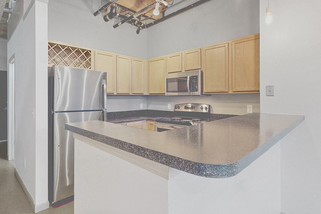 a kitchen with a counter top and a refrigerator
