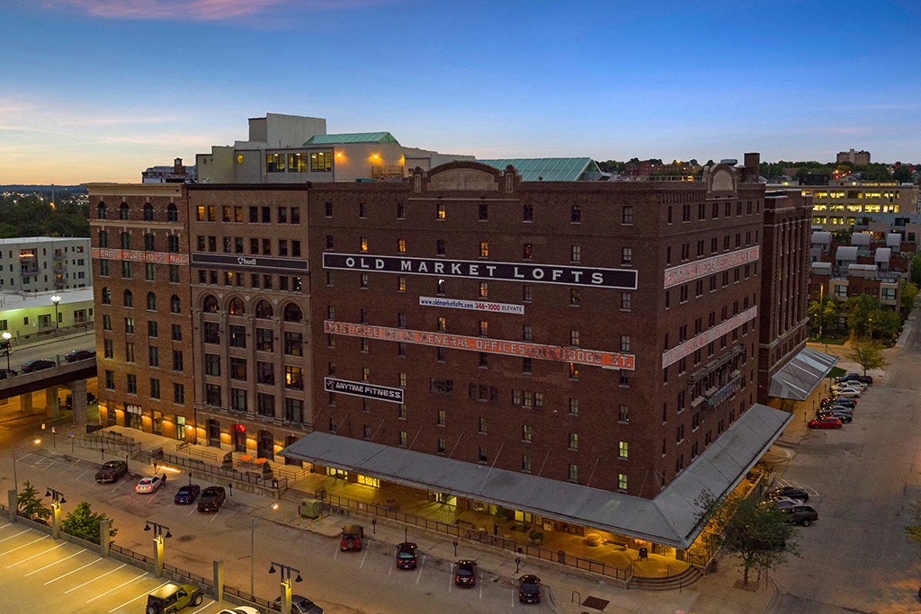 an aerial view of the old market lofts building at night