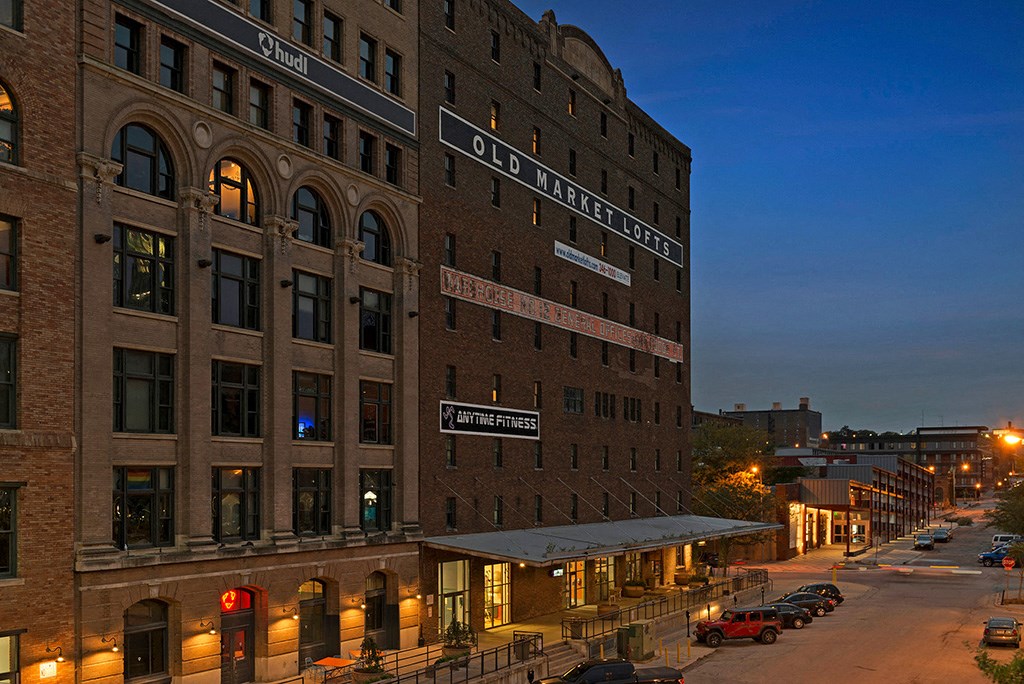 a large brick building on a city street at night