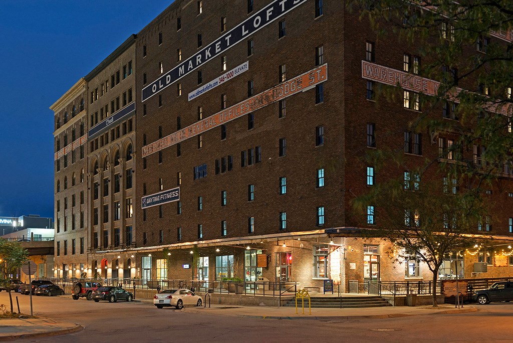 a city at night with a tall building