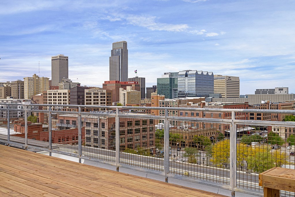 a view of the city skyline from a rooftop deck