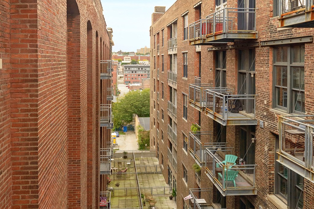 a city street with tall brick buildings and